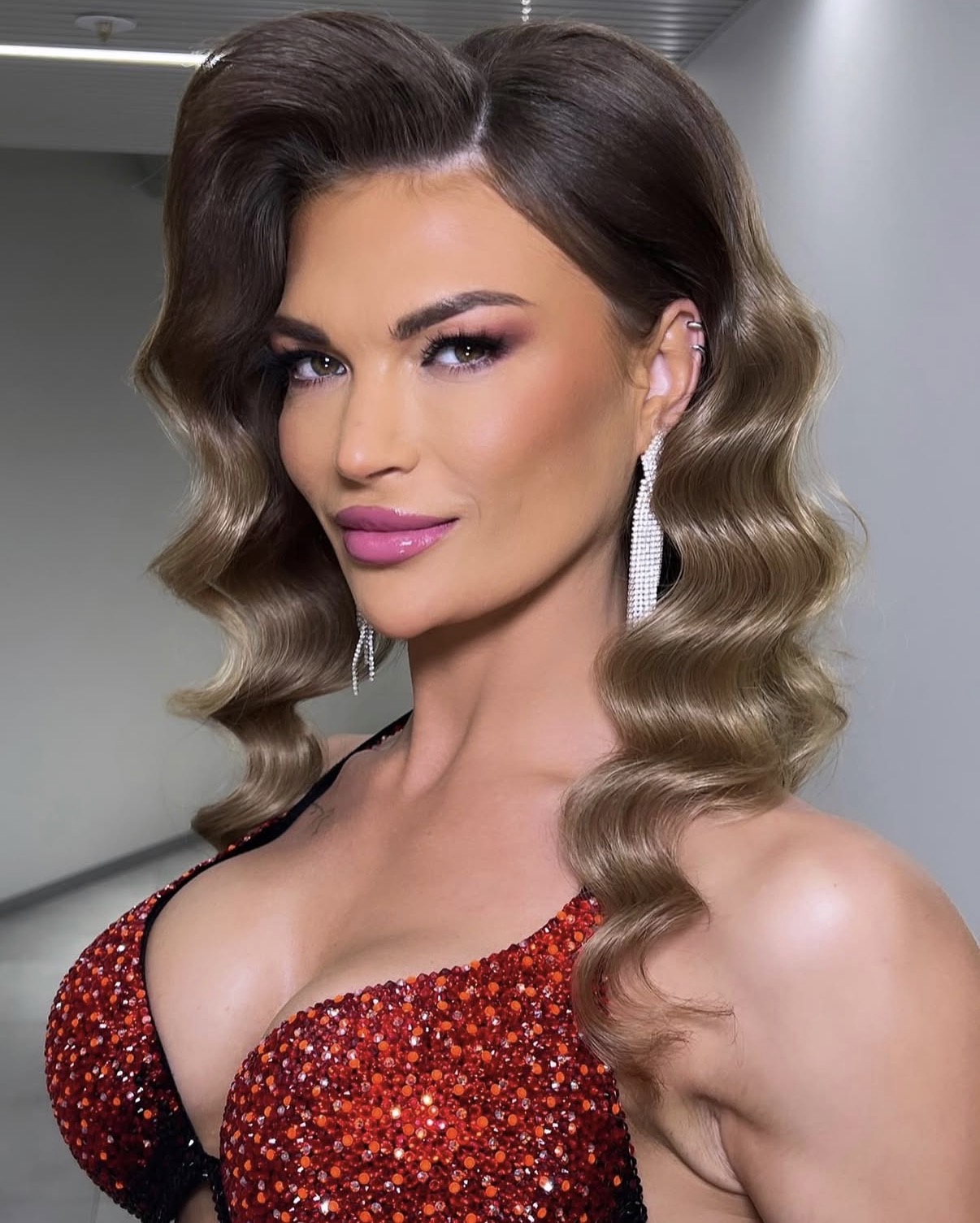 Stage makeup and Hollywood wave hairstyle for a professional athlete
